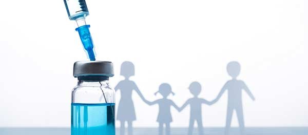 Graphic of a vial of medicine with a paper cutout of a family