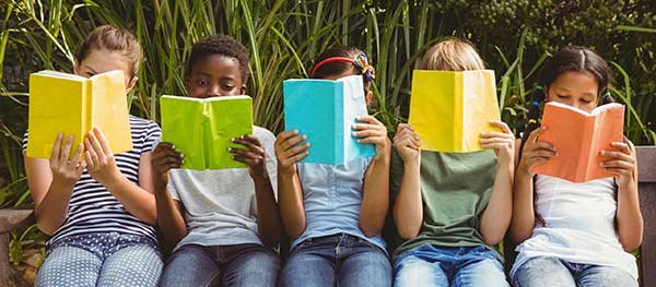 Row of kids reading books