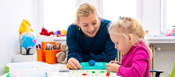 Teacher and child in a classroom