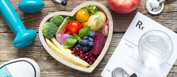 Heart shaped plate filled with healthy foods