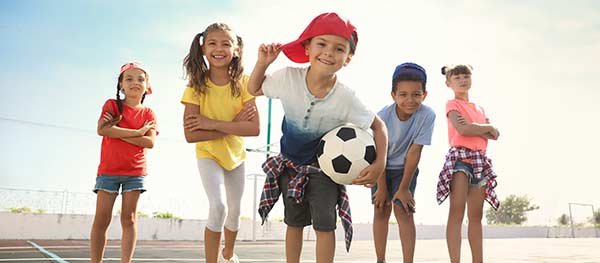Group of small kids playing soccer
