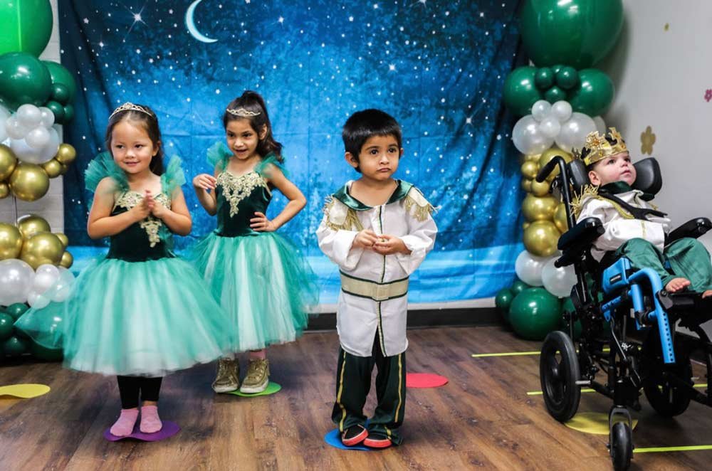 Group of small children at recital in costumes