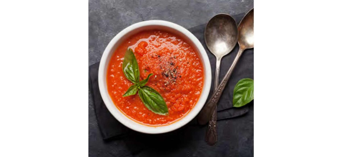 Bowl of tomato soup with fresh basil